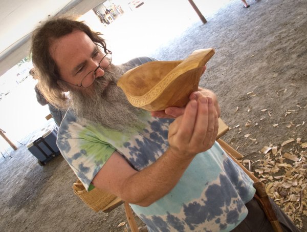 Peter explains the shape of one of his bowls.