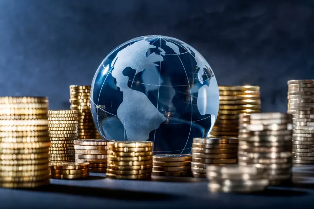 Globe with stack of coins