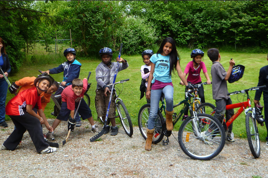 Children use donated sports equipment and bikes from REC for Kids