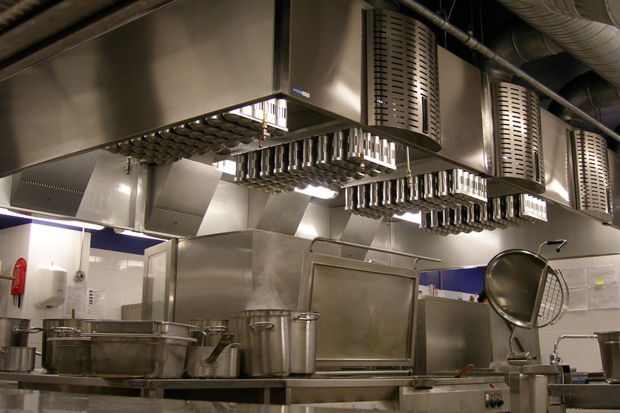 A kitchen full of stainless steel surfaces and utensils looks clean and sterilized