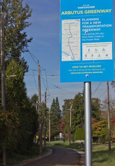 Blue sign overlooking the Arbutus Greenway, Vancouver